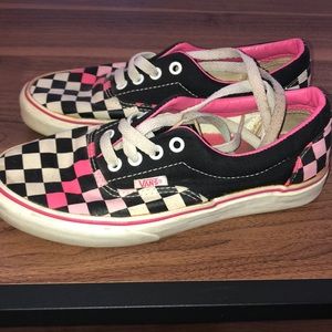 Pink and black checkered vans.